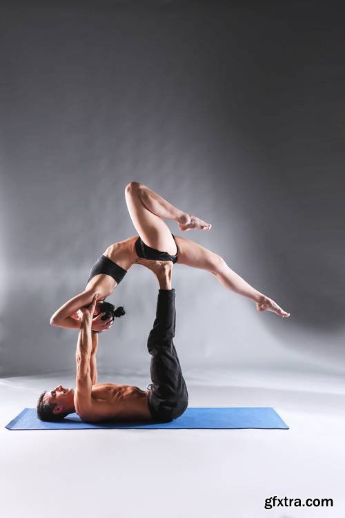 Young Couple Practicing Acro Yoga