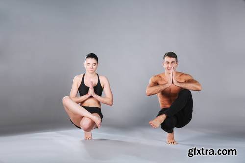 Young Couple Practicing Acro Yoga