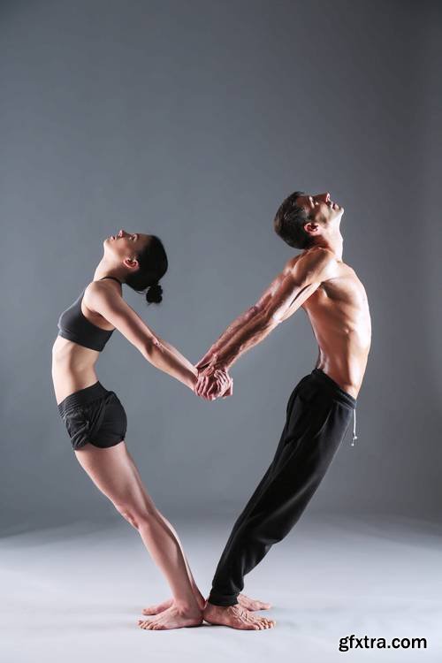 Young Couple Practicing Acro Yoga