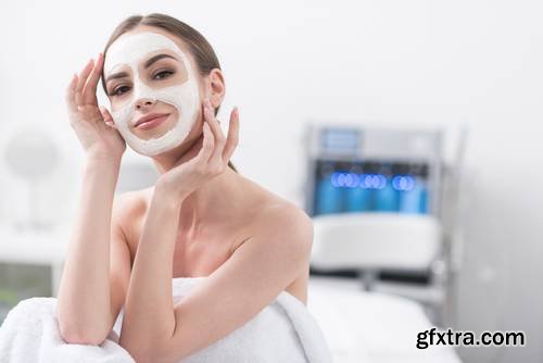 Attractive Young Woman is Enjoying Facial Treatment