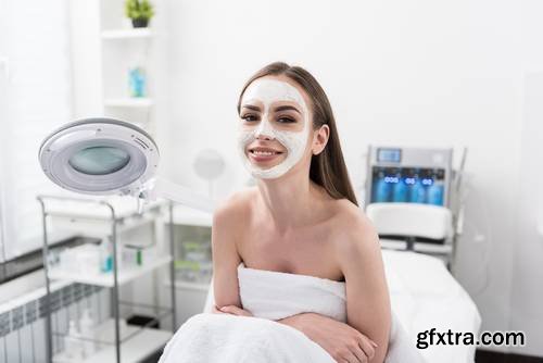 Attractive Young Woman is Enjoying Facial Treatment