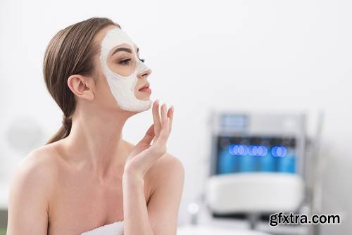 Attractive Young Woman is Enjoying Facial Treatment