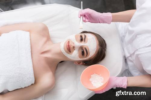 Attractive Young Woman is Enjoying Facial Treatment