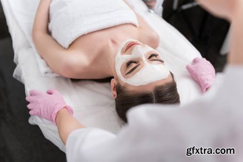 Attractive Young Woman is Enjoying Facial Treatment