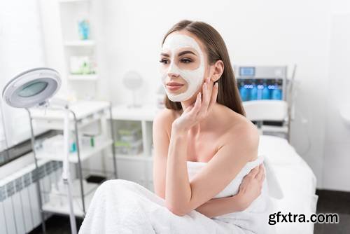 Attractive Young Woman is Enjoying Facial Treatment