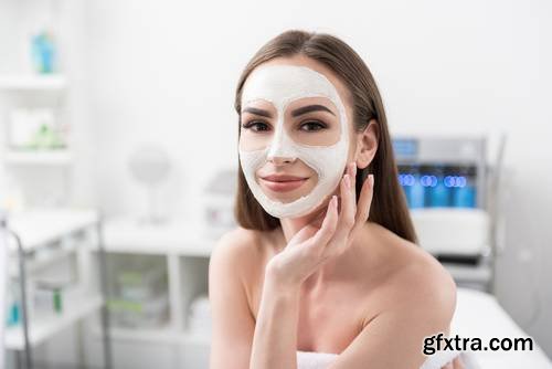 Attractive Young Woman is Enjoying Facial Treatment