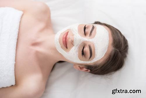 Attractive Young Woman is Enjoying Facial Treatment