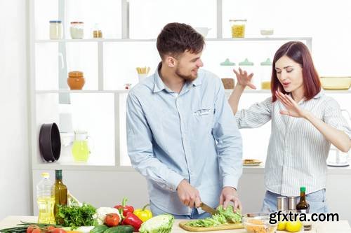 Loving Happy Couple Preparing Healthy Salad of Fresh Vegetables in Kitchen