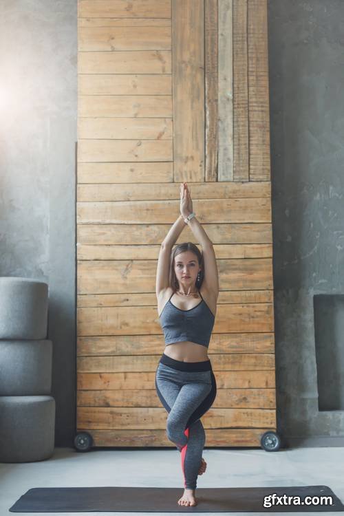 Young Attractive Woman Practicing Yoga