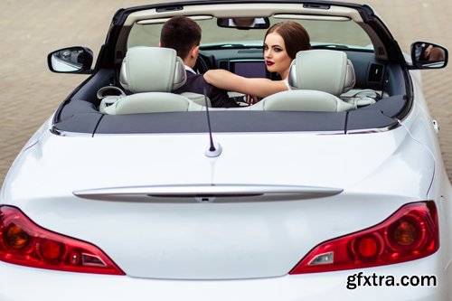 Beautiful bride and groom near the wedding car