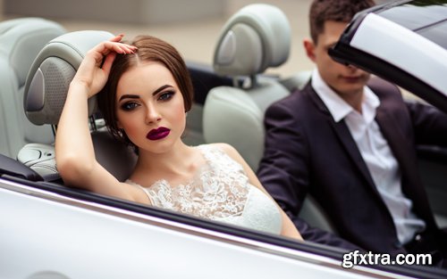 Beautiful bride and groom near the wedding car