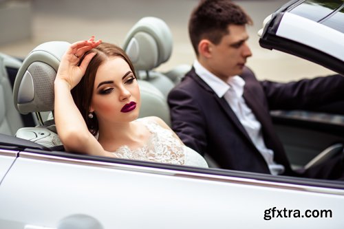 Beautiful bride and groom near the wedding car