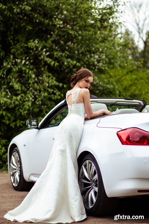 Beautiful bride and groom near the wedding car