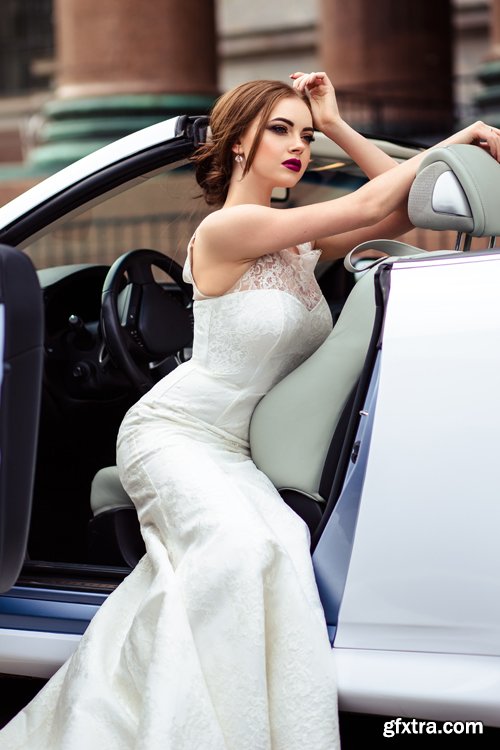 Beautiful bride and groom near the wedding car