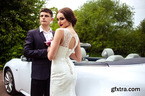 Beautiful bride and groom near the wedding car