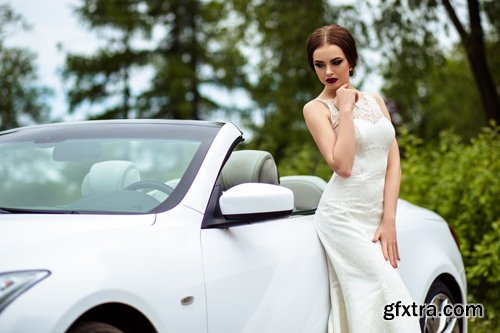 Beautiful bride and groom near the wedding car