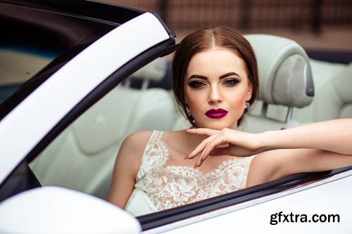 Beautiful bride and groom near the wedding car