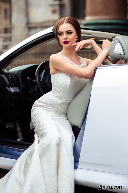 Beautiful bride and groom near the wedding car