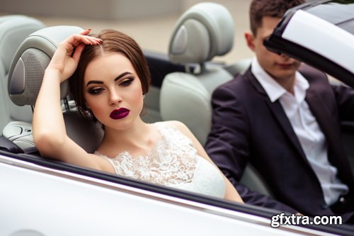 Beautiful bride and groom near the wedding car