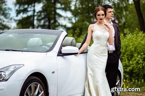 Beautiful bride and groom near the wedding car