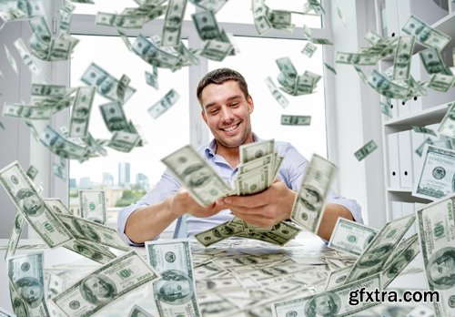 Happy businessman with heap of money in office