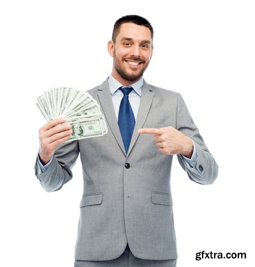 Happy businessman with heap of money in office