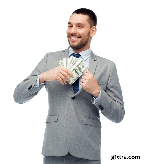 Happy businessman with heap of money in office