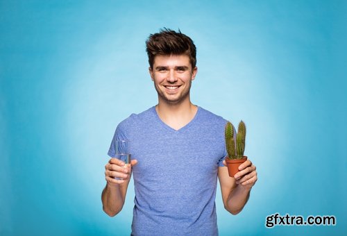 man watering a plant gardening sprout a germ 25 HQ Jpeg