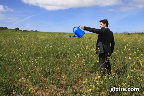 man watering a plant gardening sprout a germ 25 HQ Jpeg