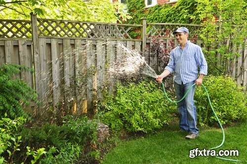 man watering a plant gardening sprout a germ 25 HQ Jpeg