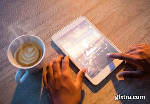 CM - Man Using Tablet At Table Mockup 1820616