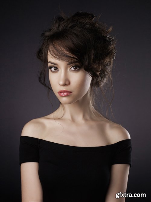 Beautiful woman with elegant hairstyle on black background