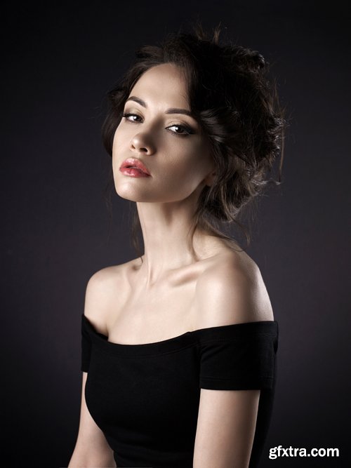 Beautiful woman with elegant hairstyle on black background