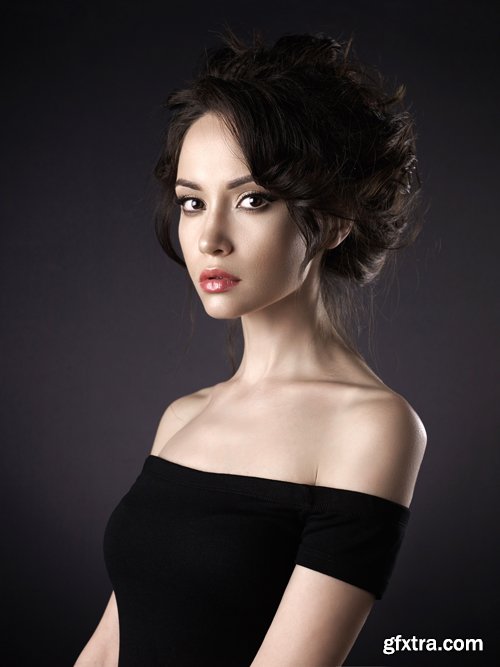 Beautiful woman with elegant hairstyle on black background