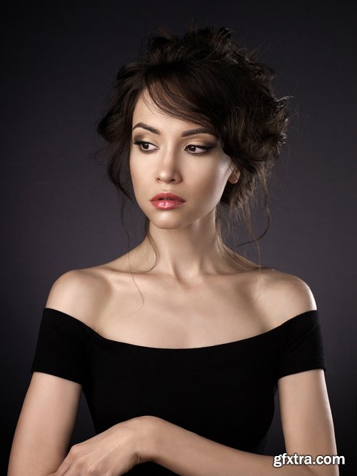 Beautiful woman with elegant hairstyle on black background