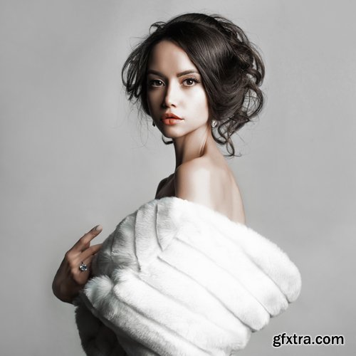 Fashion studio portrait of beautiful lady with elegant hairstyle in white fur coat