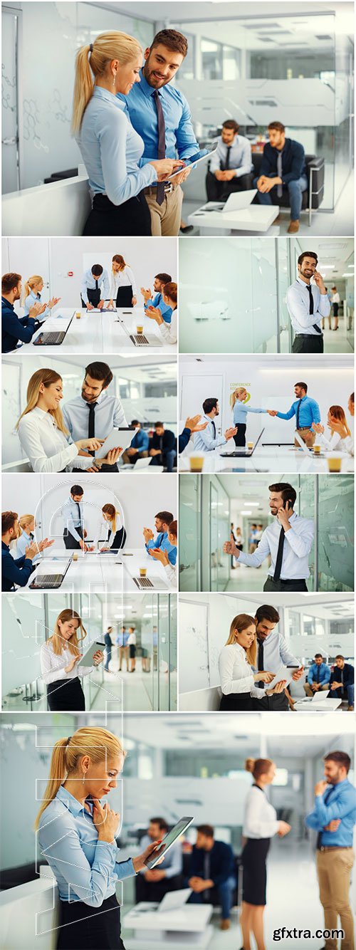 Businesswoman and businessman working with digital tablet in front of group business people