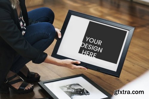 Woman holding an image frame Mockup