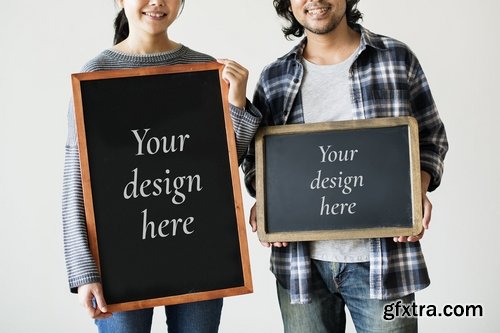 Asian couple holding wooden frames mockup