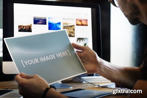 Photographer holding a mockup picture