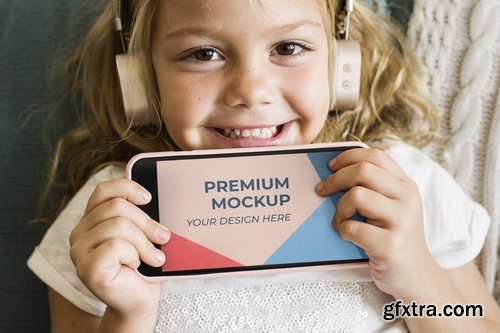 Little girl showing a phone mockup