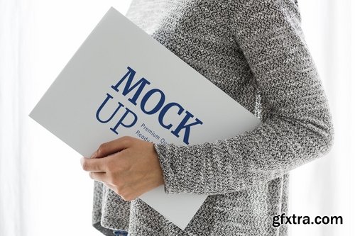 Woman holding a white Mockup board