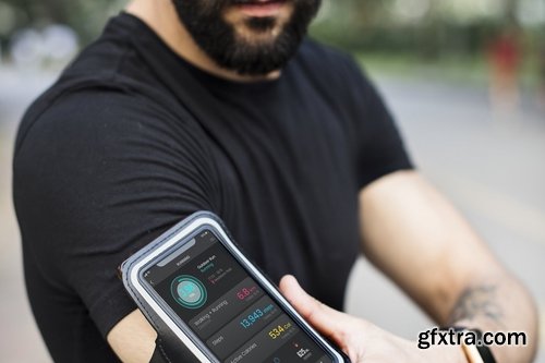 A man wearing a smartphone armband mockup screen