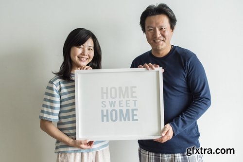 Couple Holding Photo Frame Mockup