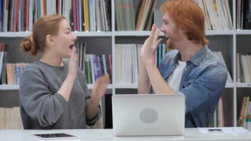 Udemy - Excited Man and Woman Reacting to Success at Work In Office