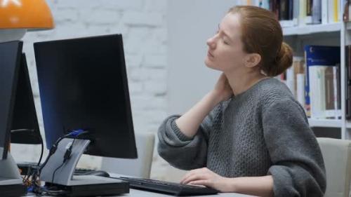 Udemy - Tired Redhead Woman Trying to Relax at Work