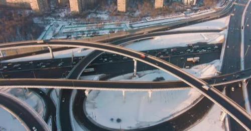 Complex Road Junction and Cars Traffic at Sunny Winter Evening in City. Aerial View - B6Q8S9G