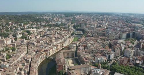 Drone Flight Over Girona Buildings and River Onyar - 7SNR4JY