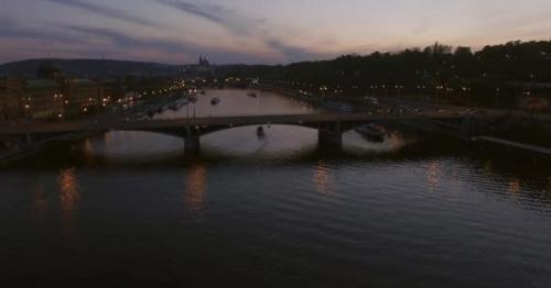 Flying Over Prague Manes Bridge, View in the Dusk - 4EB9NLU