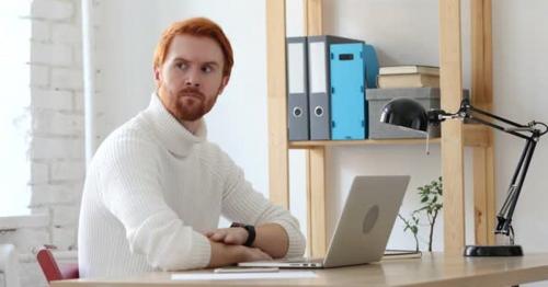 Man with Red Hairs Waiting at Work for Late Customer - TCRJVBW